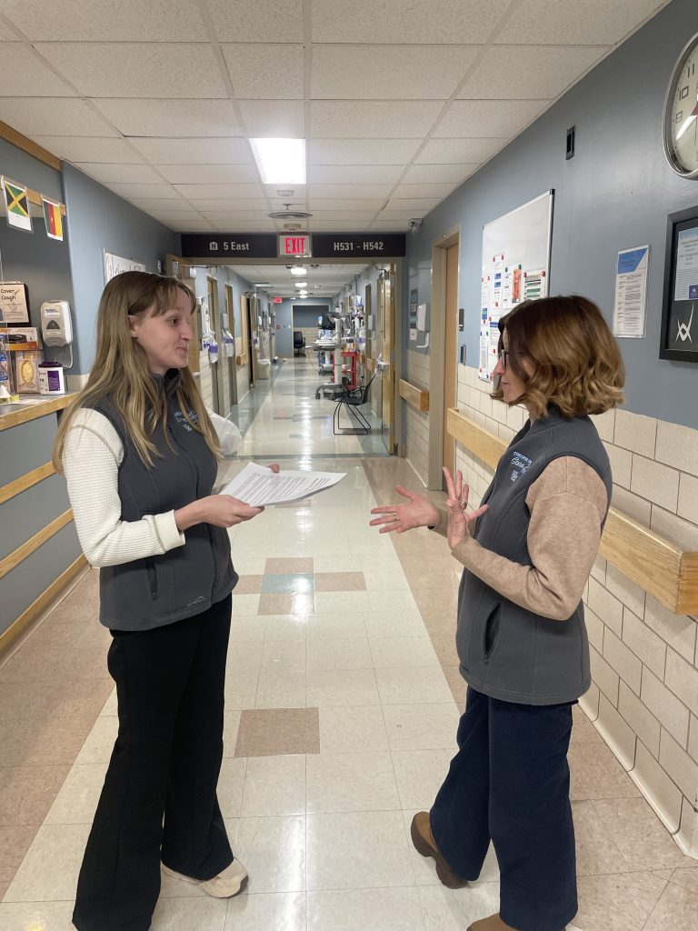 Joan Scales, Director Navigation Credentialing at the American Cancer Institute speaks with her daughter, a volunteer for the count. 