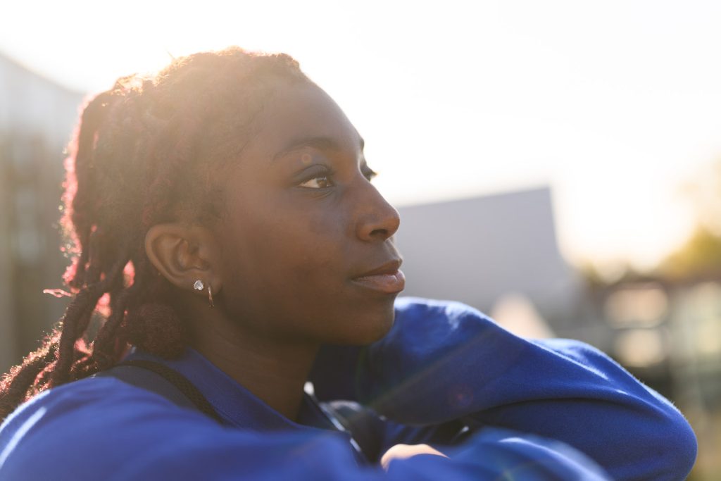 Picture of Makari Murphy with sun setting behind her