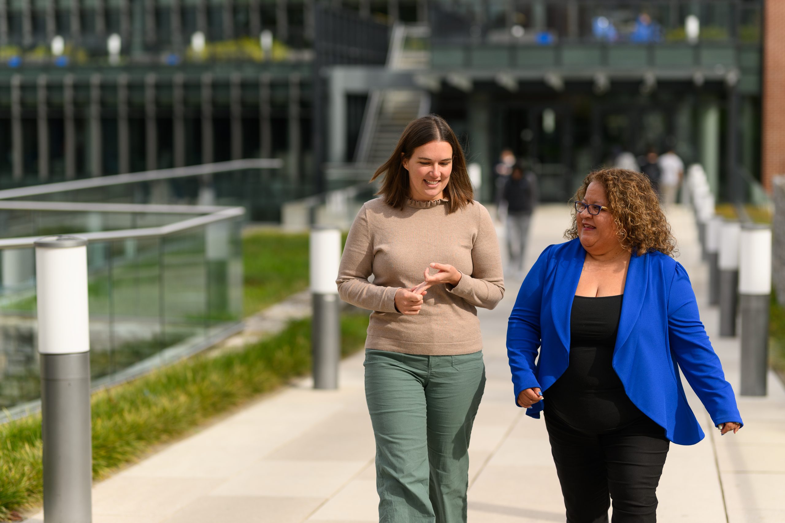 Dr. Aubrey Jones and Dr. Escobar Ratliff walking and talking outside the UK Student Center