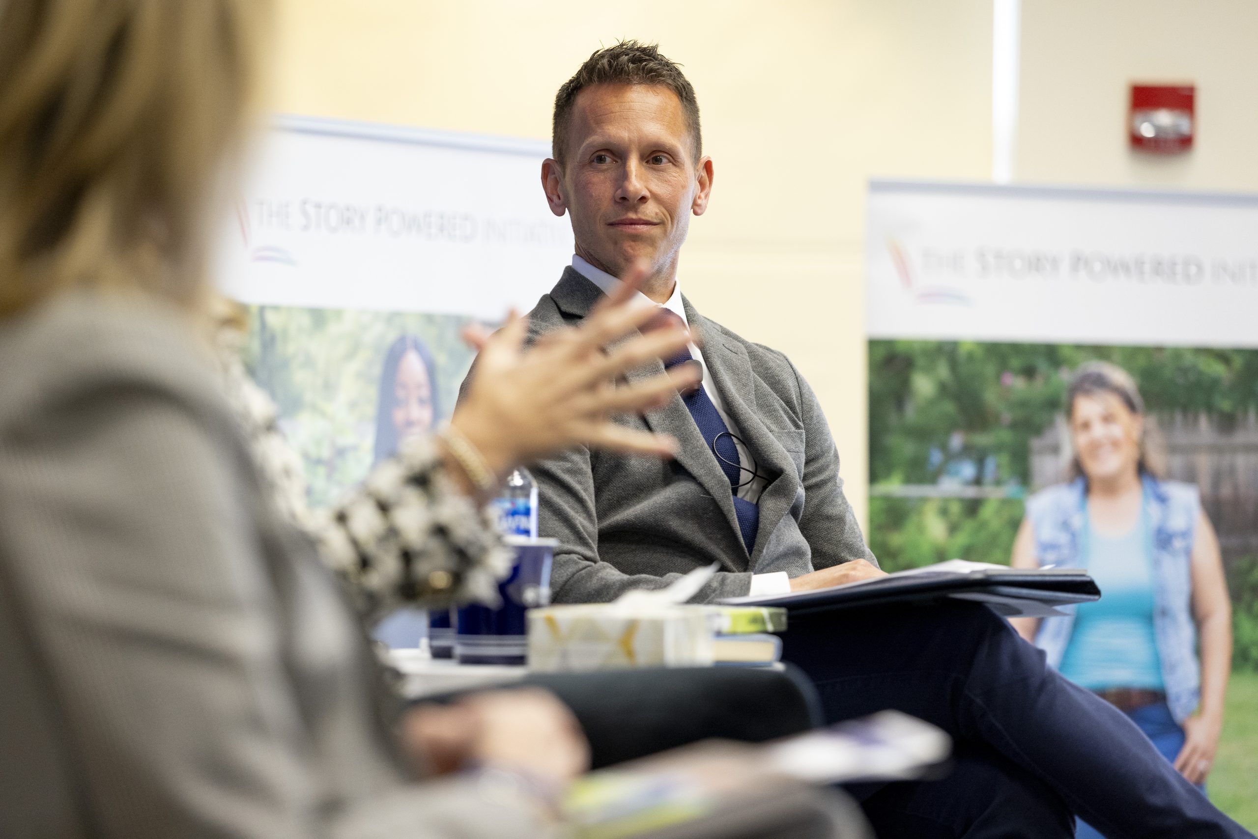 Dr. Glenn Sterner sitting on a panel listening to the speakers talk