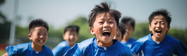 A group of children running and smiling